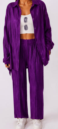 Purple outfit with a white top on a plain background