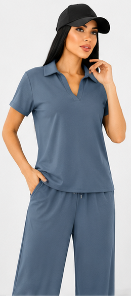Woman wearing a blue outfit with a cap on a white background