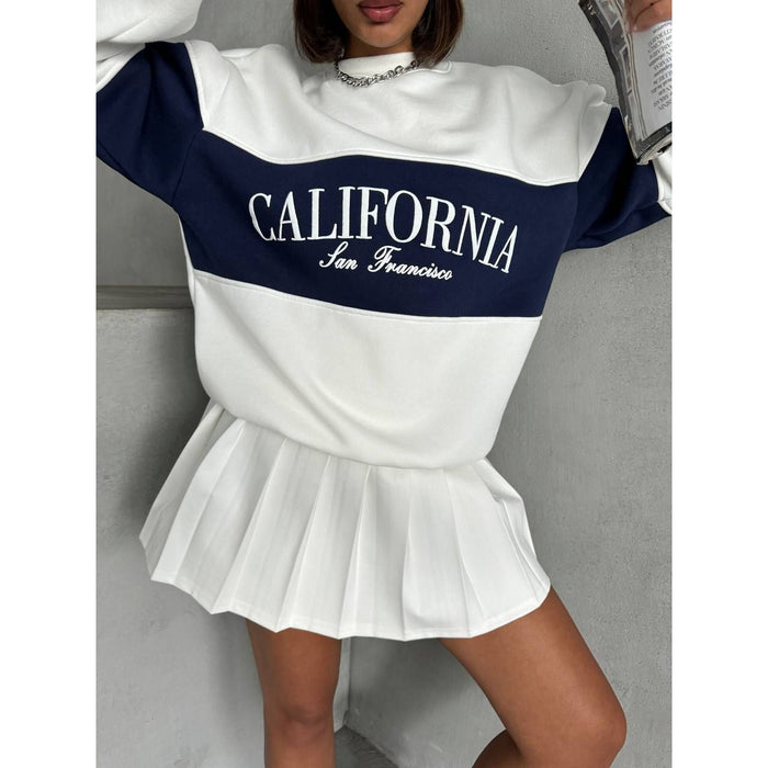 Person wearing a white and black sweatshirt with 'California San Francisco' text on a gray background