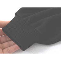 Close-up of a black ribbed knit sleeve cuff being held by a hand against a white background.
