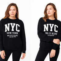 Two black sweatshirts with 'NYC New York Big City Blues' text worn by a model on a white background.