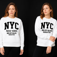 Two women wearing white sweatshirts with 'NYC' text on a black background