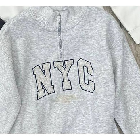 quarter zip  grey sweatshirt showing only the NYC embroidery
